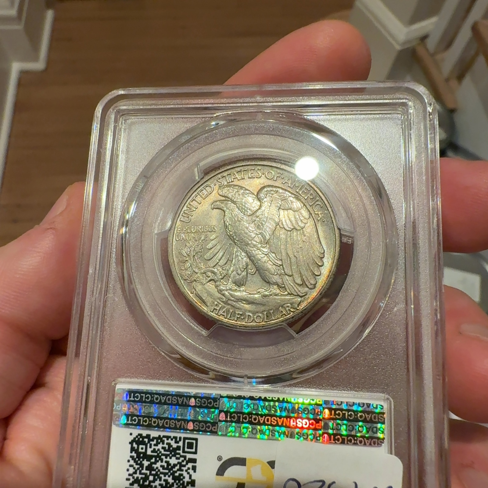 Handheld phone photograph 6 of the 1933-S Walking Liberty Half in its holder