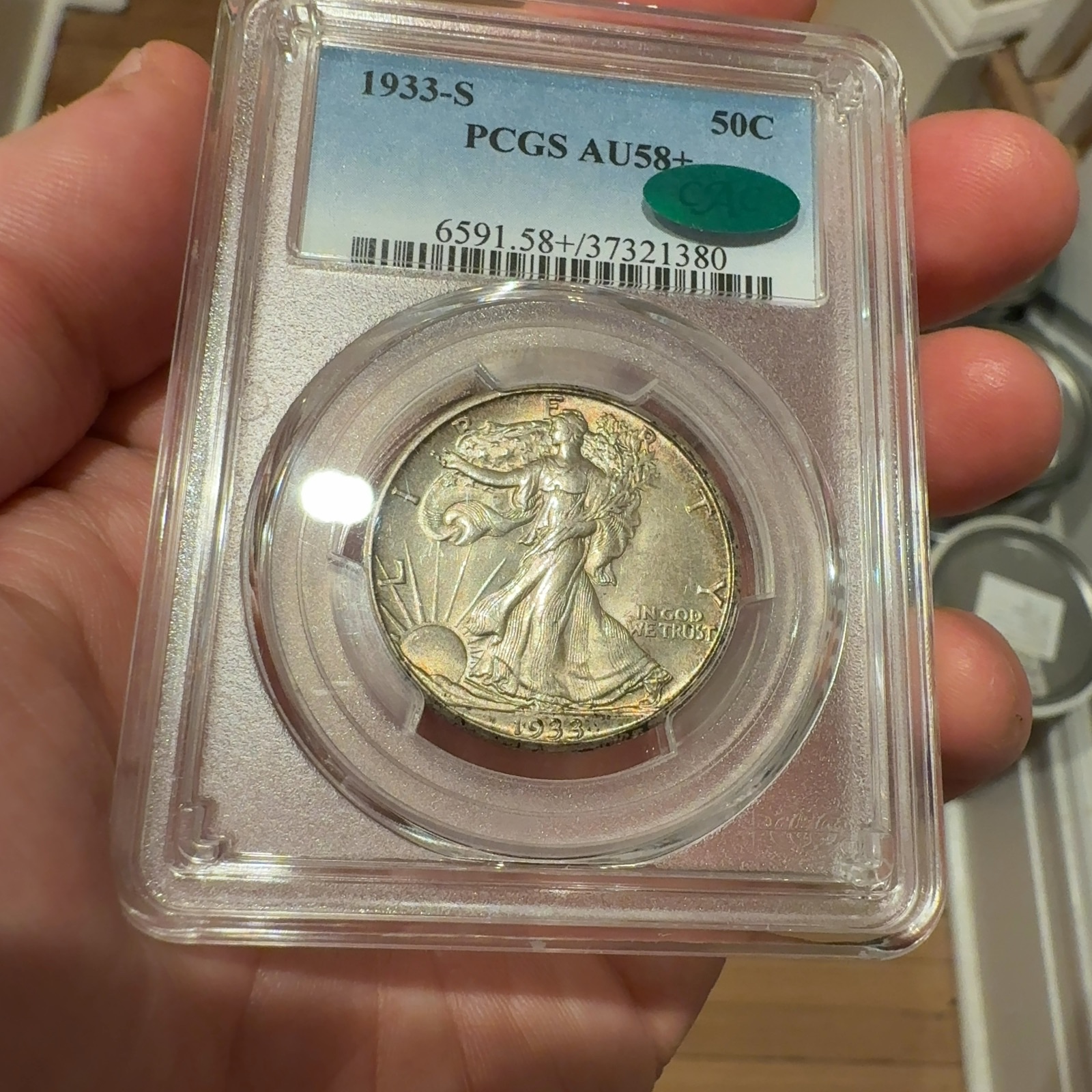 Handheld phone photograph 4 of the 1933-S Walking Liberty Half in its holder